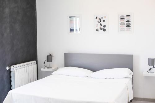 Ένα ή περισσότερα κρεβάτια σε δωμάτιο στο Sofíta - Rooms & Apartment