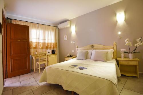 Postel nebo postele na pokoji v ubytování Hotel I Graniti