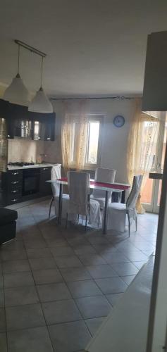 a kitchen and dining room with a table and chairs at lalunanera in Cortazzone