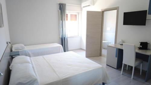 Ένα ή περισσότερα κρεβάτια σε δωμάτιο στο Sofíta - Rooms & Apartment