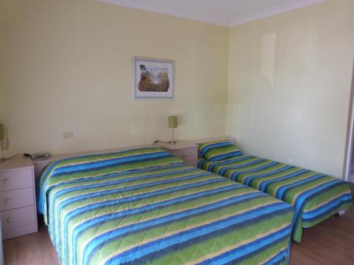 Postel nebo postele na pokoji v ubytování Fullarton Motor Lodge