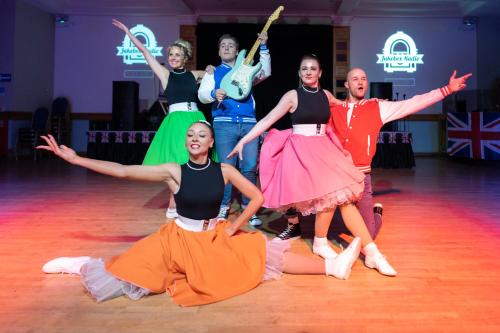 a group of dancers on a dance floor at TLH Carlton Hotel - TLH Leisure, Entertainment and Spa Resort in Torquay