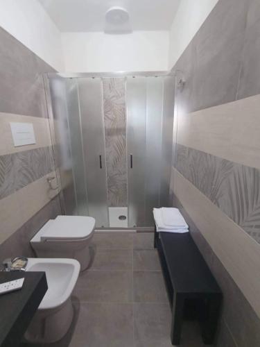 a bathroom with two toilets and a shower at B&B Antica Hera in Foce del Sele