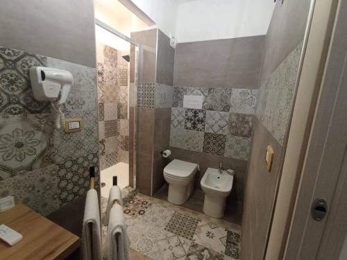 a small bathroom with a toilet and a sink at B&B Antica Hera in Foce del Sele