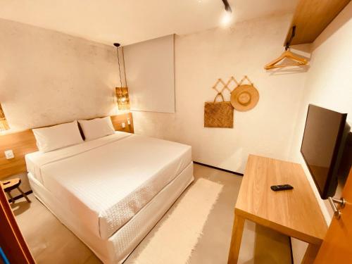 Een bed of bedden in een kamer bij Villas Patacho - Milagres Apto 103 Bloco G ( ER Hospedagens )