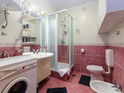 a bathroom with a sink and a toilet and a shower at Apartment Nenad in Dramalj