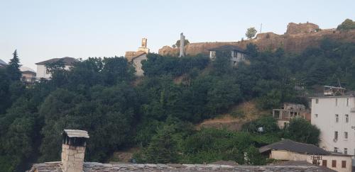 a group of houses on the side of a hill at Silver Hill Guesthouse in Gjirokastër