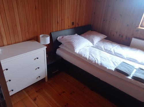 A bed or beds in a room at Żurawie Wzgórze