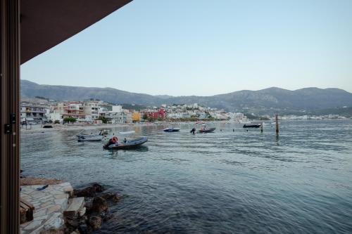 a group of boats in a body of water at Artis Blue Relax in Himare