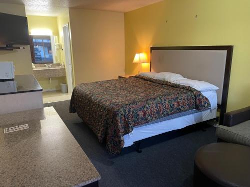 Postel nebo postele na pokoji v ubytování Executive Inn