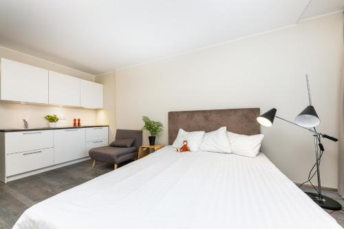 Postel nebo postele na pokoji v ubytování Aisa 39 Apartments