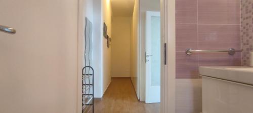 a bathroom with a walk in shower next to a sink at Casa vacanze Lucilla in Cecina