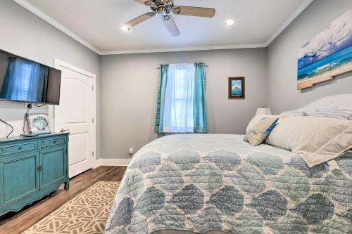 a bedroom with a bed and a ceiling fan at Dauphin Island Retreat 2 Blocks to Beach! in Dauphin Island