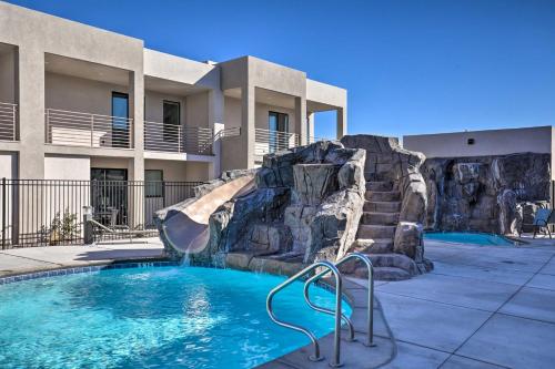 a swimming pool with a water slide in front of a building at Sunny Resort Townhome and Balcony and Pool Access in St. George