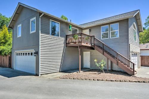 a house with a staircase on the side of it at Close to Parks and Brews Sunny Grants Pass Apt! in Grants Pass