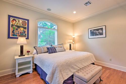 a bedroom with a large bed and a window at Adorable New Orleans Home about 6 Mi to Uptown! in New Orleans