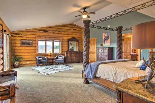 a bedroom with a bed and a table and chairs at Stunning Mountain-View Ranch on 132 Acres! in Georgetown