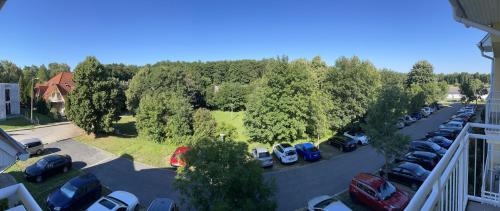 an aerial view of a parking lot with cars parked at Franci Wellness Apartman Zalakaros in Zalakaros