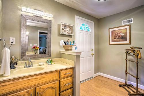 a bathroom with a sink and a mirror at Secluded Chattanooga Getaway with Deck and Yard! in Chattanooga