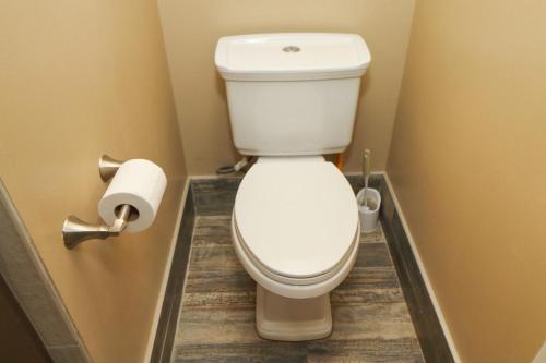 a bathroom with a toilet and a roll of toilet paper at Windjammer 307 in Saint Augustine