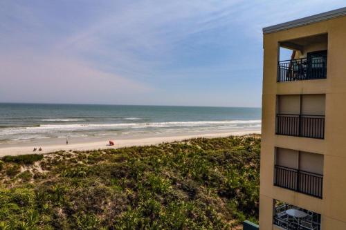 a view of the beach from the balcony of a building at Windjammer 307 in Saint Augustine