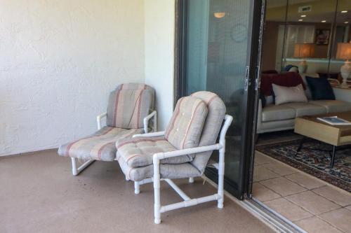 two chairs and a couch in a living room at Windjammer 307 in Saint Augustine