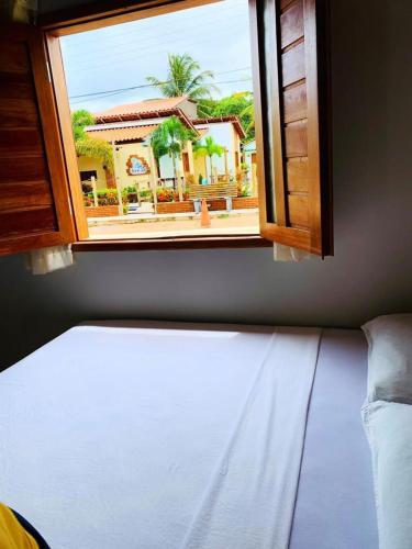 a view from a window of a room with a building at CASA DE PRAIA CORURIPE - LAGOA DO PAU in Coruripe