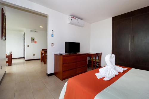 Postel nebo postele na pokoji v ubytování Galapagos Apartments - Bay View House