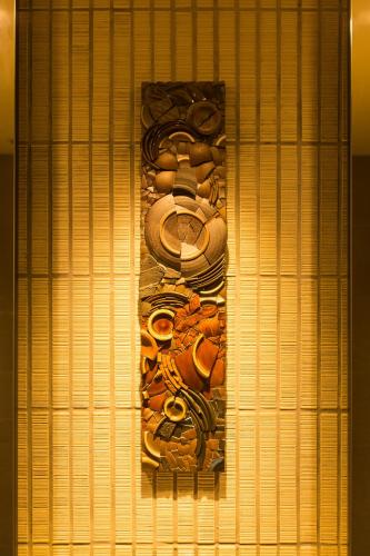 a wall with a bunch of objects on it at JR Kyushu Hotel Blossom Shinjuku in Tokyo