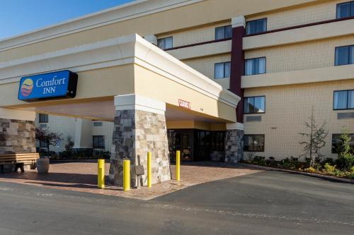 a building with a sign that reads cancer inn at Comfort Inn Tulsa Midtown in Tulsa
