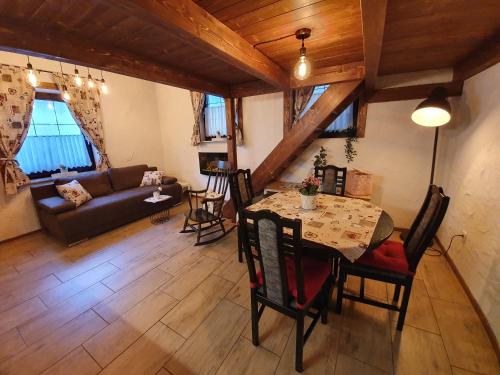 a living room with a table and a couch at Studio Srce in Kranjska Gora