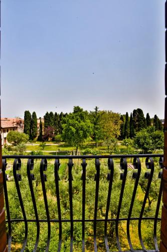a iron fence with a view of a park at Maison Boutique Al Redentore in Venice