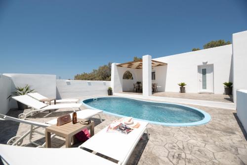 a swimming pool on the roof of a villa at Villa Echedra in Vlychada