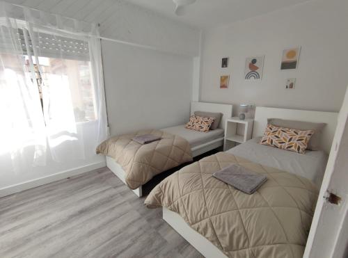 Säng eller sängar i ett rum på Sande Playa De Gandia