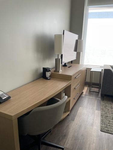 a desk with a chair and a computer on it at Hyatt Place Tulsa/Downtown in Tulsa