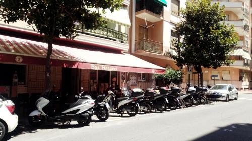 a row of motorcycles parked in front of a building at Affittacamere L'Orchidea in Ventimiglia
