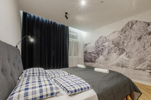 Postel nebo postele na pokoji v ubytování Apartamenty i pokoje Krupówki 16, Na Szczytach