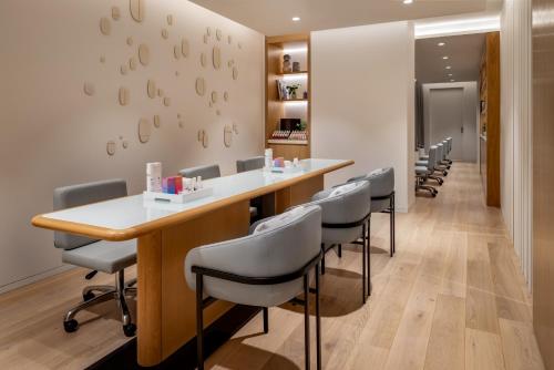a dental office with a long table and chairs at Park Hyatt Toronto in Toronto