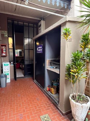 an entrance to an office with an open door at Ferienhaus Hostel Salta in Salta