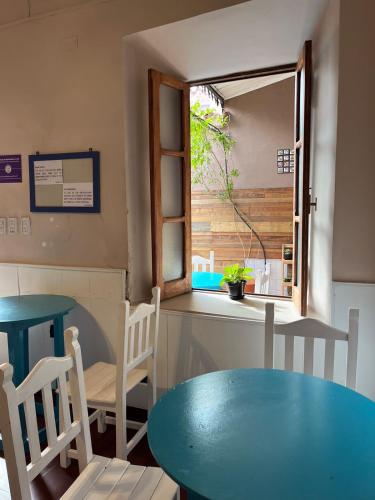 a kitchen with a table and chairs and a window at Ferienhaus Hostel Salta in Salta