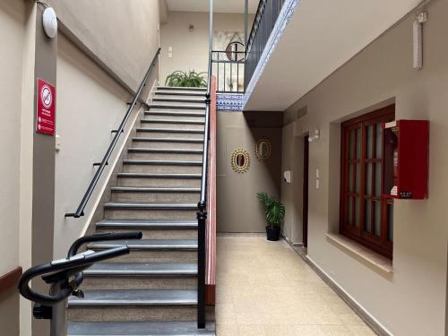a staircase in a building with a treadmill at Ferienhaus Hostel Salta in Salta