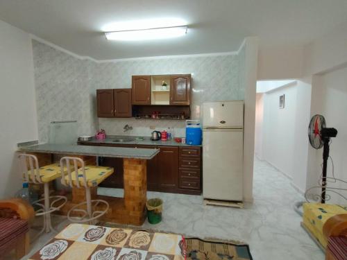 a kitchen with a counter and a refrigerator in it at Rivera Beach 1 - Ras Sedr in Ras Sedr