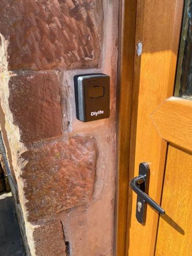 a close up of a wooden door with a handle at Kitty’s Place, Apartment, Eden Valley, Cumbria in Brampton