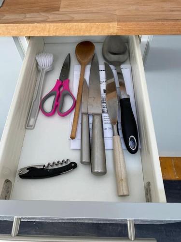 a drawer filled with lots of kitchen utensils at Kitty’s Place, Apartment, Eden Valley, Cumbria in Brampton