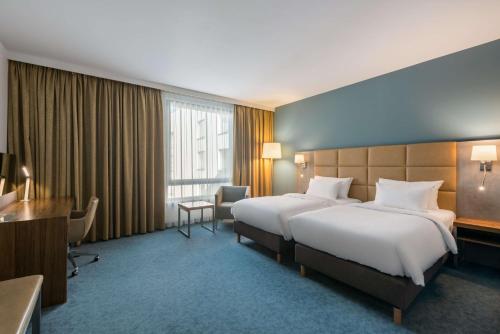 Ліжко або ліжка в номері Radisson Blu Hotel Krakow