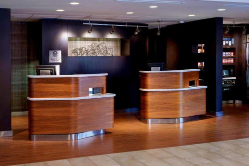 a barber shop with wooden counters in a room at Sonesta Select Kansas City Airport Tiffany Springs in Kansas City