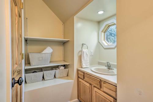 a bathroom with a sink and a mirror at Renovated Lake Geneva Home Near Dtwn and Beach! in Lake Geneva