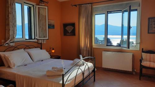 Ένα ή περισσότερα κρεβάτια σε δωμάτιο στο Alekos Beach Houses-Mitis