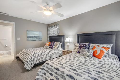 a bedroom with two beds and a ceiling fan at Oyster Bay Villas --- 37500 Kaitlyn Dr Unit #23 in Rehoboth Beach