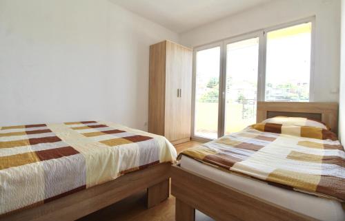 Postel nebo postele na pokoji v ubytování Bjelise Apartments